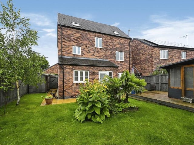 The last photo in our gallery shows a view from the rear of the £385,000 property, with the summer house just in shot to the right.