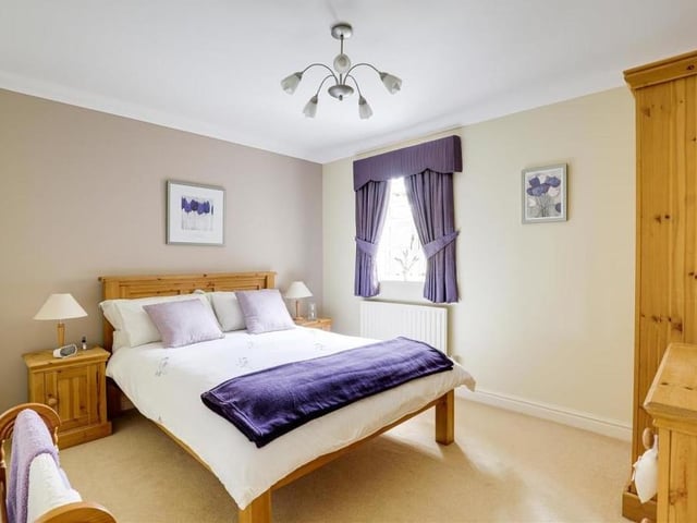 This is a bright, nay sparkling, bedroom, facing the back of the £950,000 property. Again, it benefits from a carpeted floor and coving to the ceiling.