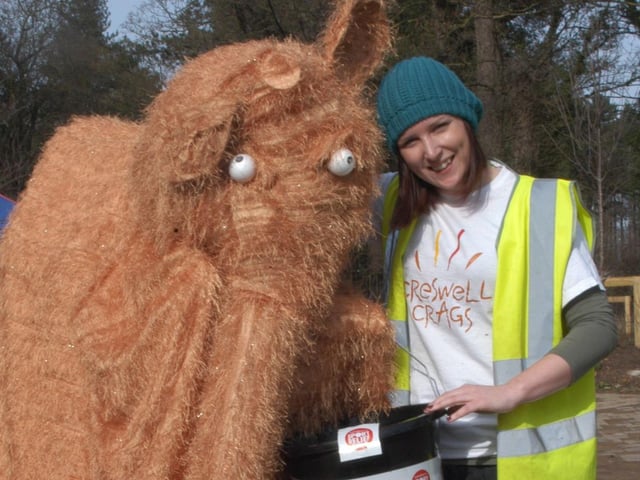 Picture: Creswell Crags worker Anna Griffiths with an ancient woolly mammoth.