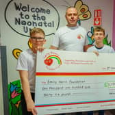 Yorkshire three peak challenge for the Emily Harris foundation at King's Mill Hospital - children intensive care unit. Ronan and Craig Scutt, and Alfie Bowskill present a cheque to Claire Harris from the Emily Harris Foundation.