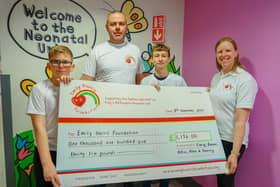 Yorkshire three peak challenge for the Emily Harris foundation at King's Mill Hospital - children intensive care unit. Ronan and Craig Scutt, and Alfie Bowskill present a cheque to Claire Harris from the Emily Harris Foundation.