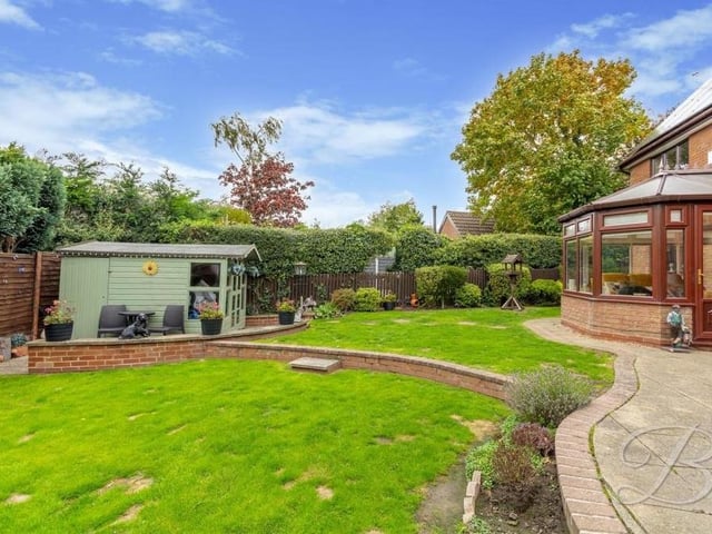 The back garden at the Lichfield Lane property is fully enclosed, offering a large degree of privacy. The clever layout is easy in the eye.