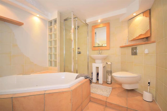 Fitted with a spa-style bath, shower cubicle and low-level WC. The property's second bathroom is currently being refurbished.