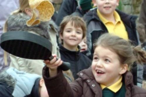 Young pupil Harriet shows off her pancake flipping skills.