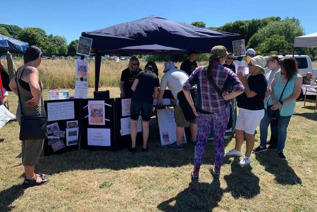 Switch volunteers - Janet Fritchley, Nadine McGuiness, Karen Bonsall and Richard McGuiness - are pictured, speaking with residents at the Warsop carnival stall. Group member, Ken Bonsall, had 'Save Warsop Town Hall' printed on shirts for the team.