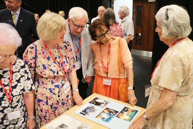 Jane (right) shows Eileen Matthews, Paul and Christine Bacon and the infamous pantomime photographs