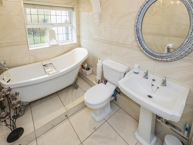 The family bathroom is fitted with a four-piece suite, comprising a free-standing, claw-foot, rolltop bath, glazed shower cubicle, wash hand basin and WC. The walls and floor are fully tiled, and this room also offers access to the loft.