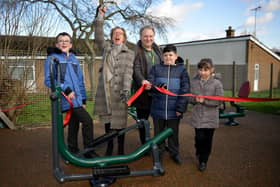 Official opening of outdoor gym equipment at Intake Farm Primary and Nursery School, Mansfield.  Pictured cutting the ribbon is Councillor Diana Meale with coun Paul Henshaw and children George, Spencer and Hannah