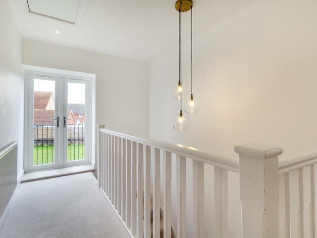 Climbing the stairs to the first floor, you are greeted by a galleried landing that includes French doors leading to original stone steps down to the garden. There is also a loft hatch and six ceiling spotlights.