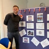 Coun Ben Bradley with the board in his office decorated in coronation theme.