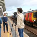 Students interviewing Mansfield mayor Andy Abrahams at the train station for the final film
