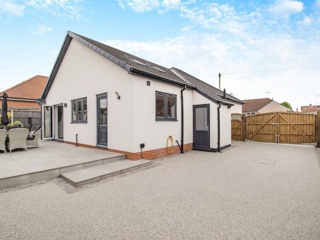 Time to take a look outside now, starting with a large resin driveway that leads from double gates at the front of the property and stretches down the side, providing lots of off-street parking space.