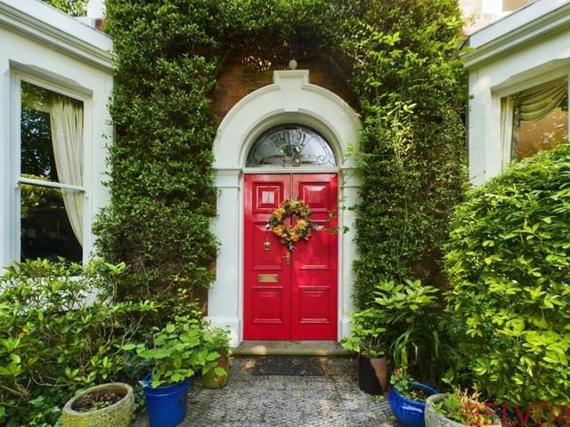 Step through this impressive double front door, framed by a mature, cultivated hedge, to take a look inside the £795,000 Mansfield property. An entrance porch has tiled flooring, a fitted bench and coat hooks.