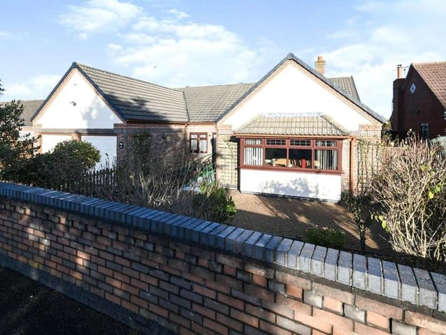 The winter sun catches the sweet and enclosed frontage as we say farewell to the Emerald Grove bungalow in Kirkby.