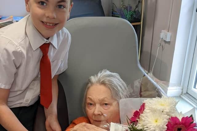 Josh hand-delivering a bunch of flowers to his granny.