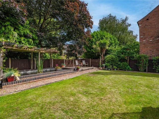 To the sides and rear of the property is a mature garden that is mainly laid to lawn with a variety of shrubs and bushes, there is a raised fishpond within the garden.