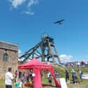 One of the highlights of the gala day as an RAF Lancaster bomber flies over the iconic and historic buildings at the Pleasley pit site