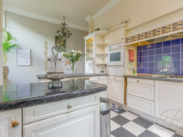 Estate agents BuckleyBrown freely admit that the kitchen is in need of some renovation and modernisation, but it is still a fantastic culinary hub with lots of worktop space. Integrated appliances include an oven and hob with extractor fan above.