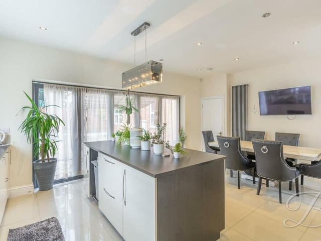 Moving on now to the magnificent kitchen diner, where there is a central island and plenty of space for a dinner and/or breakfast table. Large bi-folding doors lead out to the rear garden.