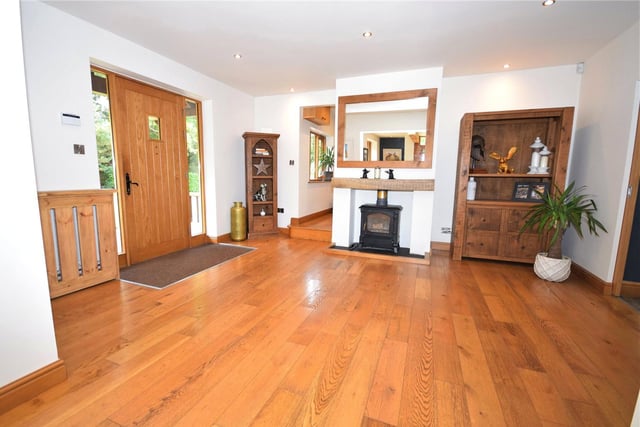 Through the front door and into this vast reception hall. Its combination of character and contemporary finishes sets the tone for the rest of the property. The space, with its solid oak floor and atmospheric dpwnlighting, could even be used as a dining area if you wish.