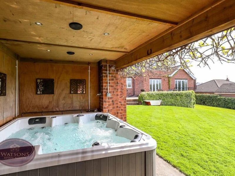 The rear garden includes a covered entertainment area, with power and timber decking. It is the ideal space for a hot tub if that takes your fancy.