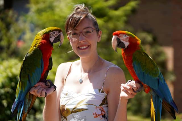 Chloe Brown, of Kirkby, and her parrots, Motley, left, and Echo, that she takes to fly in the Peak District.