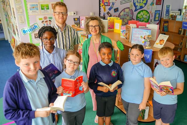 Pupils at Abbey Hill Primary School join headteacher Helen Chambers and deputy headteacher Adam Jevons-Newman to celebrate the Kirkby school's good Ofsted report. Picture: Brian Eyre/nationalworld.com