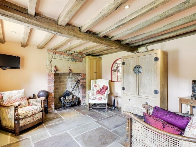 Other assets to be found in the sitting room are exposed oak beams to the ceiling and a feature fireplace with exposed-brick chimney breast alcove. The room benefits from underfloor heating.