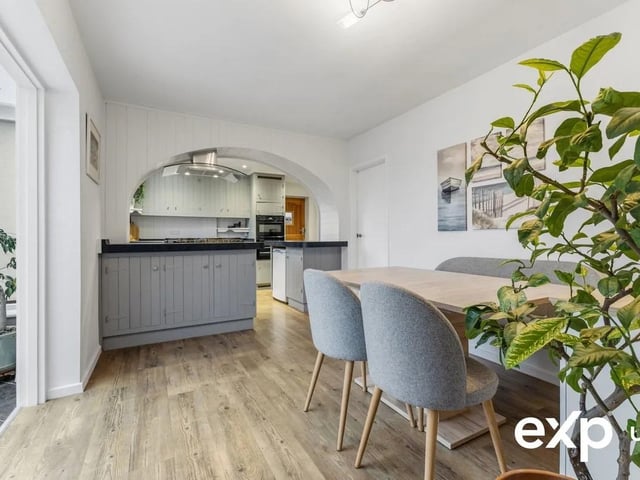 This open-plan arrangement comprises a modern fitted kitchen with charming character touches and a spacious dining area. The continuous configuration creates a fantastic expansive light-filled atmosphere with an elegant archway framing the easy flow that is laid out in useable areas.