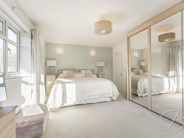 The property boasts ample bedrooms for a growing family. This bedroom has built in wardrobes, dual aspect windows to front and side elevation and central heating radiator.