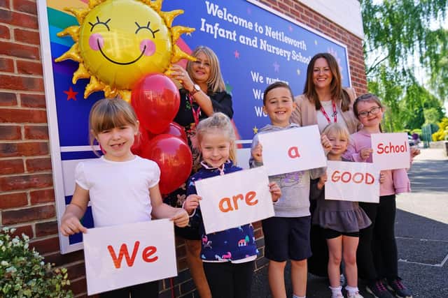 Staff and pupils at Nettleworth Infant and Nursery School, including headteacher Debbie Hyslop, back left, celebrate the school's good Ofsted report.