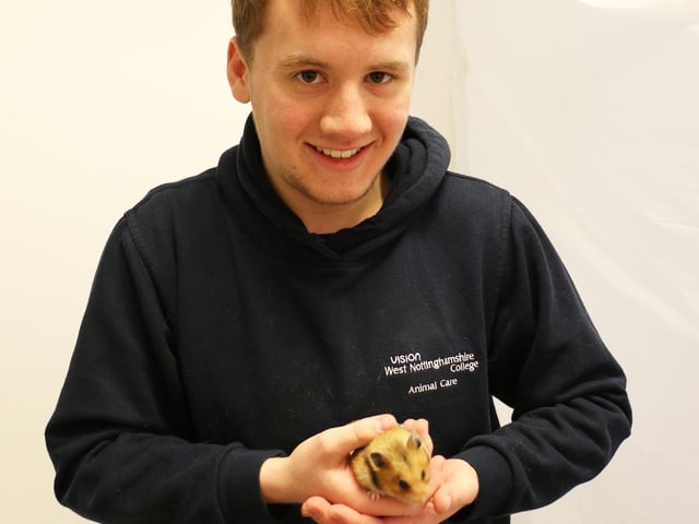 Animal care student Oliver Wigglesworth, pictured with Billy the hamster, showed families around the unit.