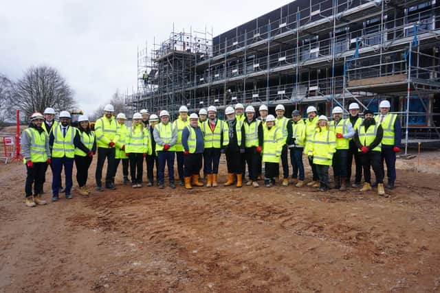 Councillors and partners gather at the site of the new school