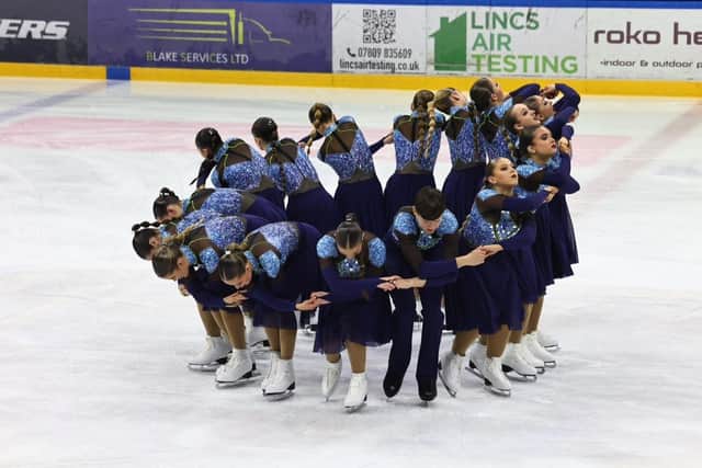 Members of the Nottingham Synchronized Skating Academy (NSSA)'s Icicles Junior team in formation on the ice