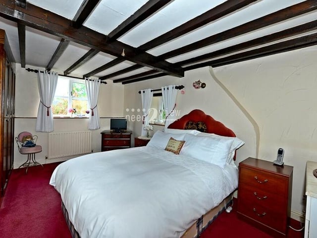 Moving up to the first floor now, and here is the largest of the three bedrooms. It faces the back of the property.