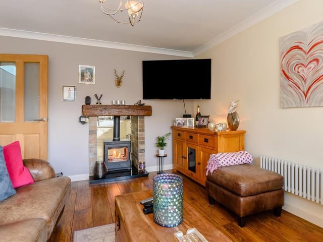 Radiating warmth, the lounge also features an inset dual log-burner with granite hearth. A night in front of the TV has rarely looked so appealing.