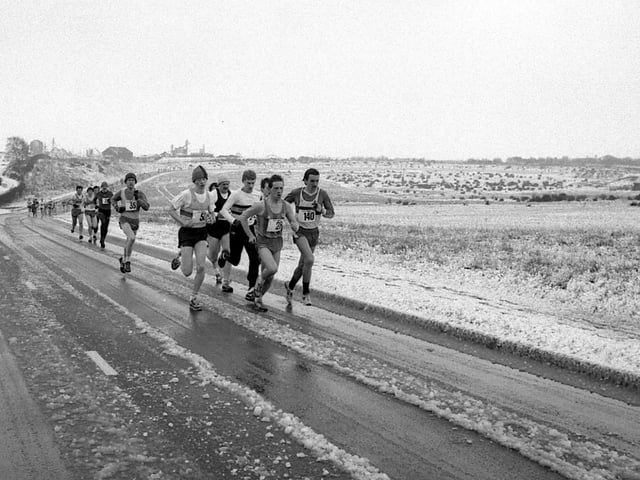 A group of runners brave the cold roads of Mansfield back in 1986.