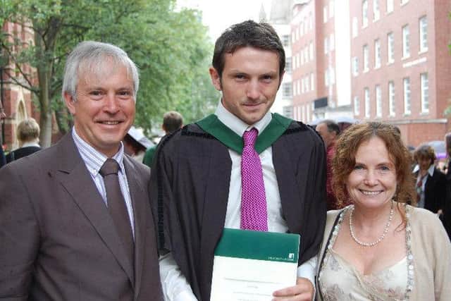 James Clegg with his parents at his graduation