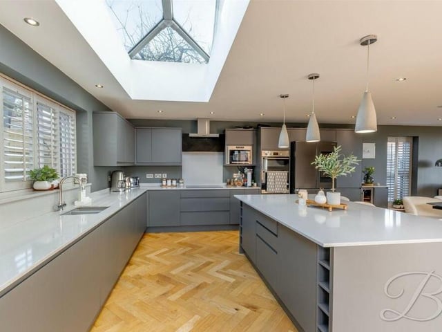 The sleek and silky kitchen boasts a range of stylish units with complementary quartz worktops, under-counter lighting and inset sink with mixer tap over. Integrated appliances include an oven, dishwasher, washing machine, microwave and wine cooler.