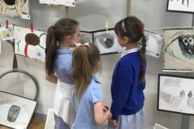 Pupils admiring their works of art at Lawrence View.