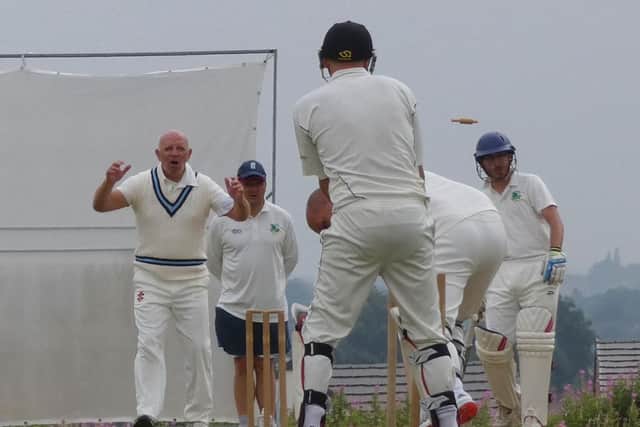 Bowler John Worthy takes the final Riddings wicket. Pic by Martin Roberts.