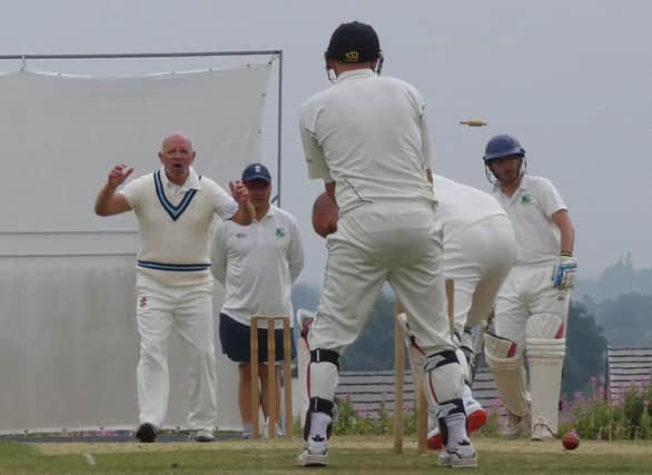 Bowler John Worthy takes the final Riddings wicket. Pic by Martin Roberts.
