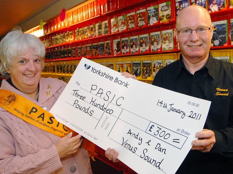 Andy Collins from Venus Sound handed over the proceeds of a charity night held at the Bentinck on New Years Eve with his son Dan, to PASIC co-ordinator Bea Brunton, at his Venus Entertainment shop in Sutton back in 2011.