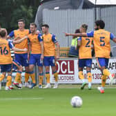 Form team Mansfield Town are expected to hold their place in the play-offs.