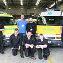 The original students who began the work on the ambulances in Mansfield.