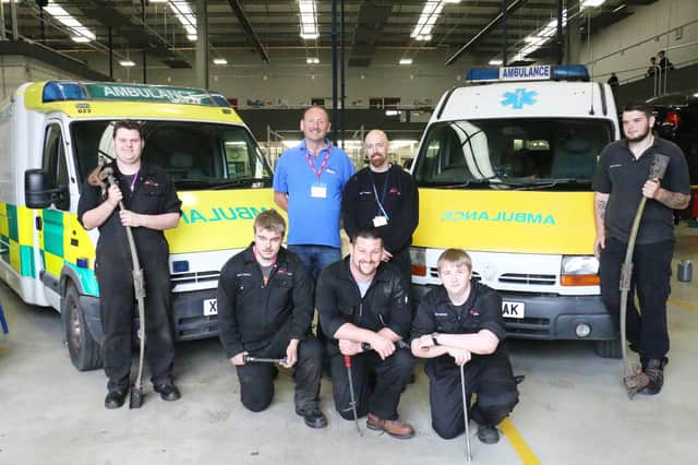 The original students who began the work on the ambulances in Mansfield.