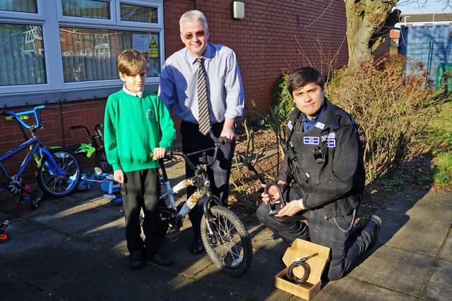 Year 6 pupil Caleb and headteacher Matthew Cumberlidge from Oak Tree Primary School and Nursery with PCSO Cyrus Crowder.
