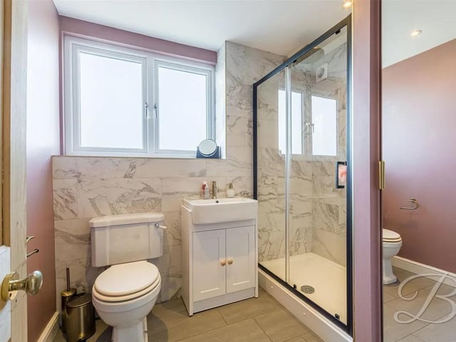 Downstairs shower room for added convenience, comprising of a hand wash basin, low flush WC and a shower.