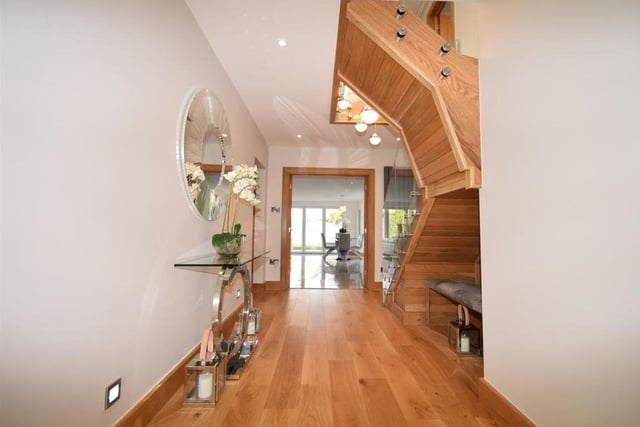 The welcoming entrance hall makes an unexpectedly terrific first impression. With space to greet family and friends, it has solid oak wood flooring, a tall column radiator, spotlights, low-level lighting and double doors to the kitchen diner.