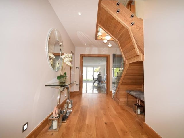 The welcoming entrance hall makes an unexpectedly terrific first impression. With space to greet family and friends, it has solid oak wood flooring, a tall column radiator, spotlights, low-level lighting and double doors to the kitchen diner.
